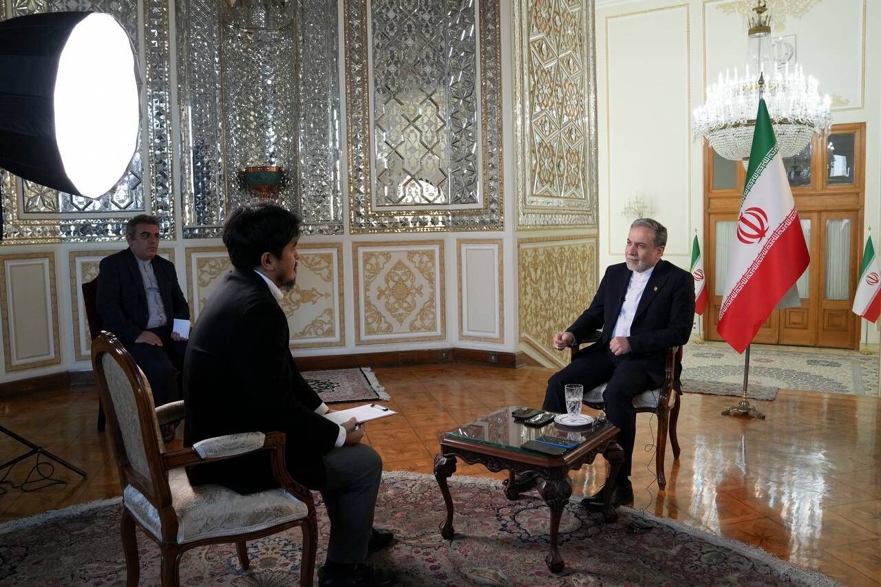 Foreign minister says Iran is determined to continue its peaceful nuclear program