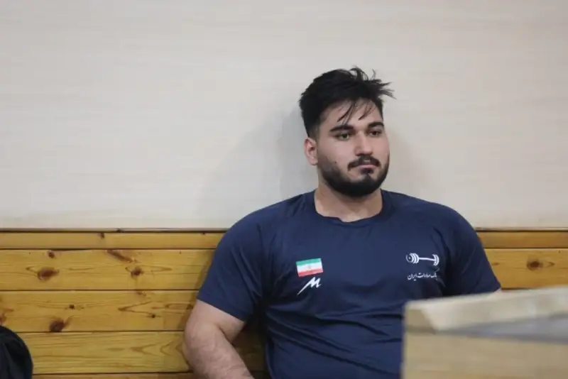 قهرمان وزنه‌برداری جهان حمله به ایران را گناه نابخشودنی خواند